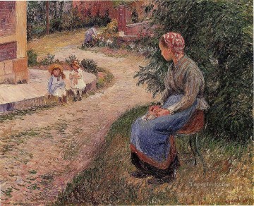  eragny Oil Painting - a servant seated in the garden at eragny 1884 Camille Pissarro